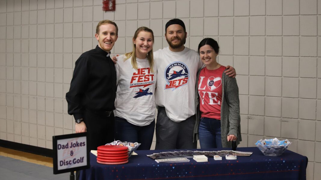 (From left to right) Father Adam Grelinger, Helfrich, Colby McKee and Emily Simon at Jet Fest.