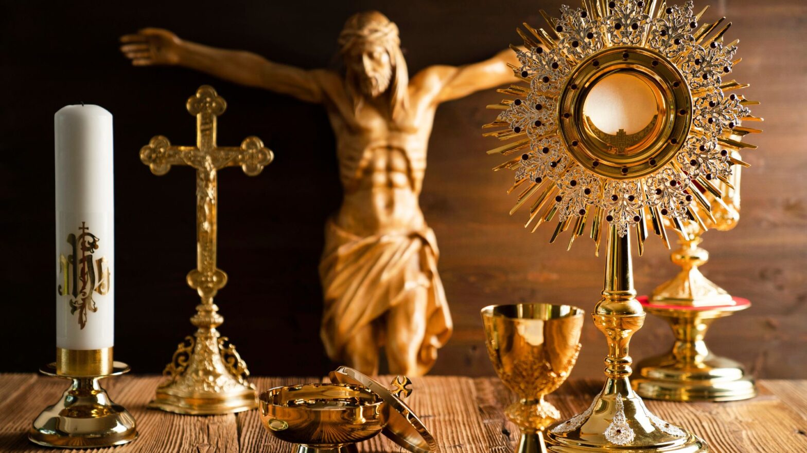 Catholic items include a gold crucifix, chalice and monstrance.