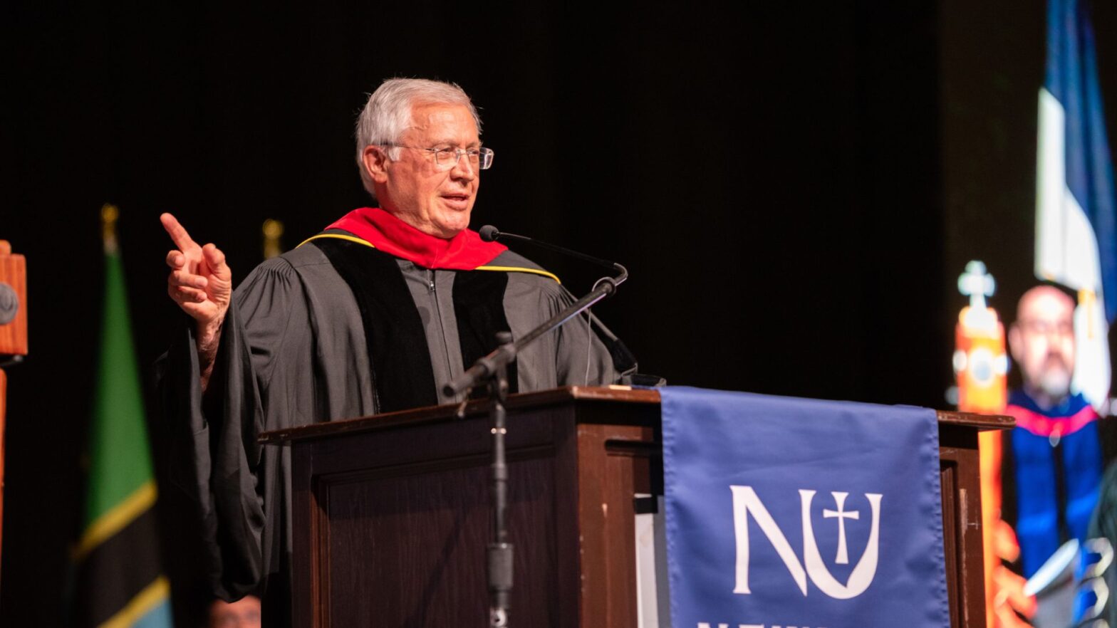 Father Tom Welk gives his commencement address to Newman University graduates on May 10.
