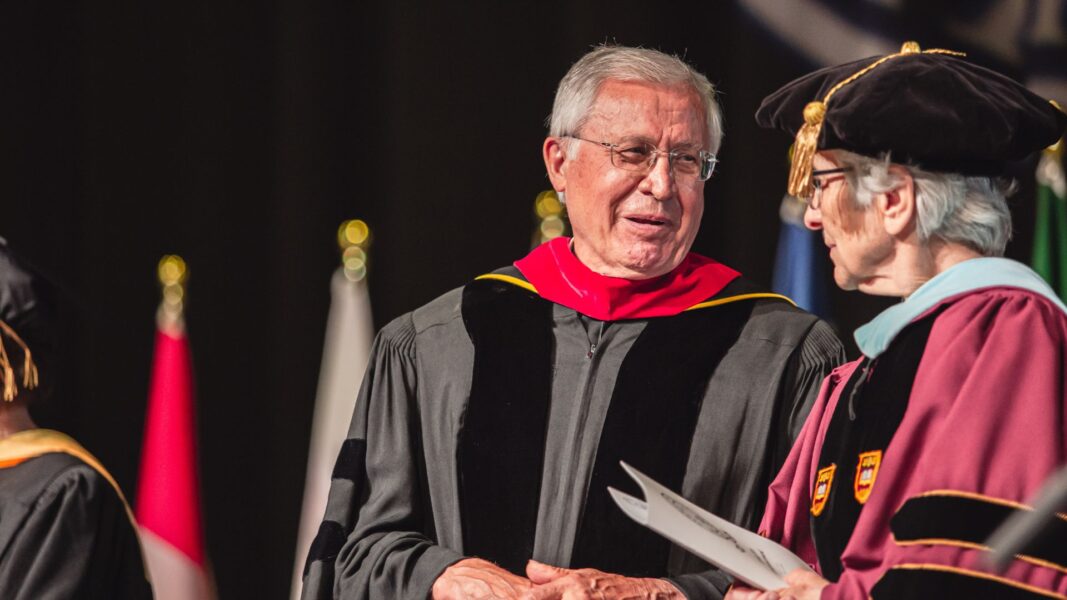 Welk speaks with Sister Therese Wetta, ASC, at commencement.