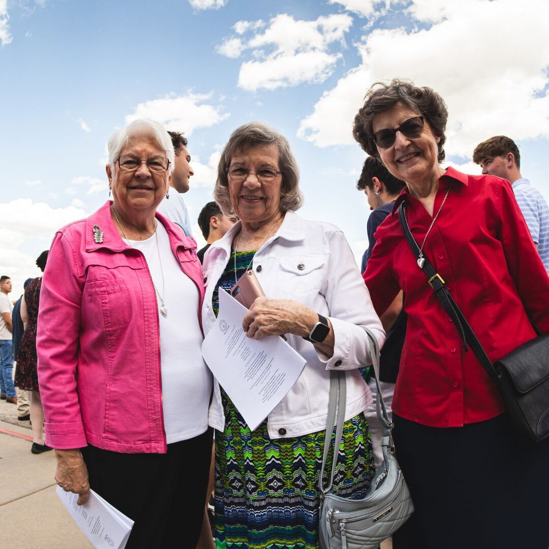 Sister Marsha Wilson, ASC, (left) attends Kang's graduation ceremony with fellow ASC sisters.