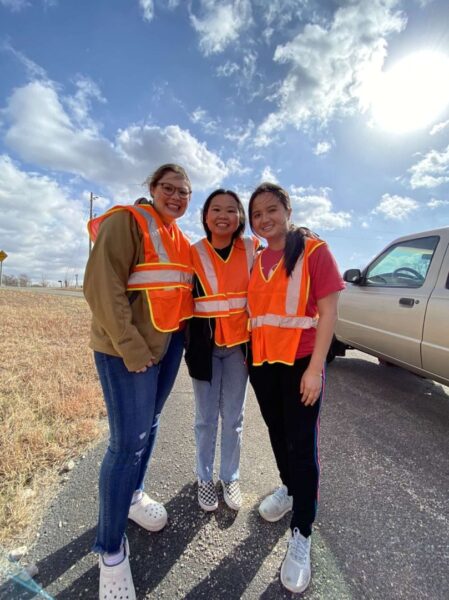 (From left to right) Sophie Johnston, Ashley Dinh, and Britney Ma help clean the highway in Manhattan, Kansas, as part of the Circle K International conference. 