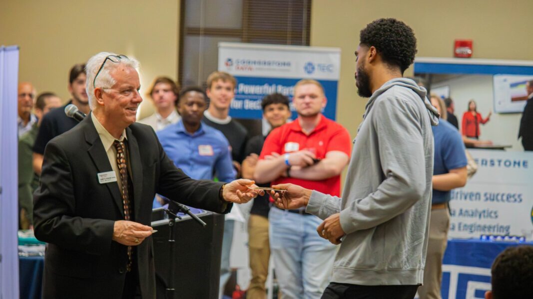 Students, professors, industry leaders and experts come together during a business mixer at Newman University