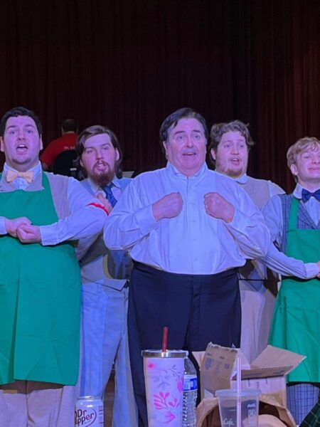 2023 Newman graduate John Suffield (second from the left) also plays a role in "Hello, Dolly." (Photo credit: Louise Brinegar)