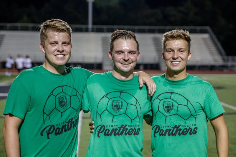 Sacket (right) with two of his brothers, Chase (left) and Austin (middle) following a Derby High School alumni soccer game in 2019.