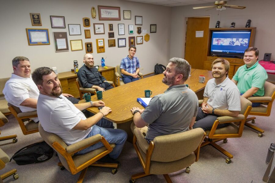 Adorer of the Blood of Christ Sister Dani Brought (on the monitor) posed from Pennsylvania for a photo with the seminarians studying in the summer Spanish immersion program at Newman University in Wichita. The seminarians from left are Joseph Schones, Kyle Pfeifer, Conrad Sissell, Thomas Elliott, Matthew Ralls, Colby McKee and Dominic Jirak. (Advance photo)