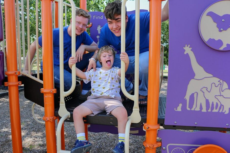 This year’s Totus Tuus Camp for children with special needs had assistance from five Totus Tuus parish teams. Pictured (from left) Totus Tuus volunteers Steven Brown and Anthony Jackson with camper Luke Milligan. (Courtesy photos)