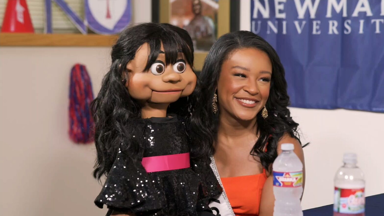 Alexis Smith holds her puppet, Aliyah, as she demonstrates her ventriloquism talent.