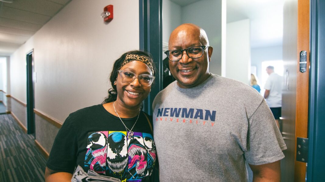 Aniya Thompson and father, Reggie, in Carrocci Hall at Newman University.