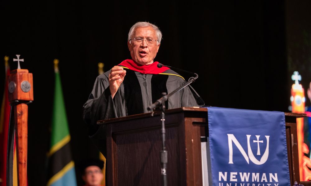 Fr. Tom Welk gives commencement address at Newman University 2024 Spring graduation ceremony.