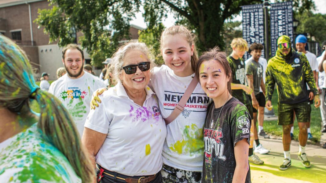 Jagger with students at the Newman Color Run event.