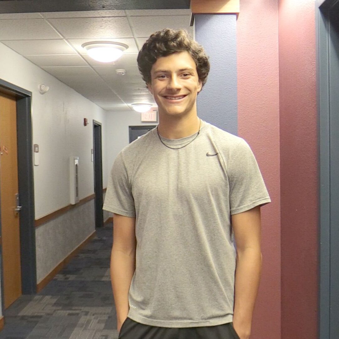 Noah Smith smiles in Carrocci Hall.