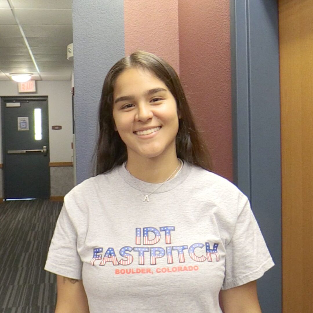 Anabella Heguy smiles in Carrocci Hall during move in day at Newman University.