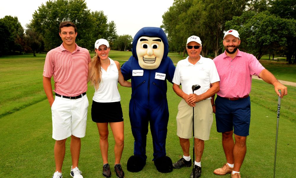 Welk with his team and Newman mascot during the Jet Open