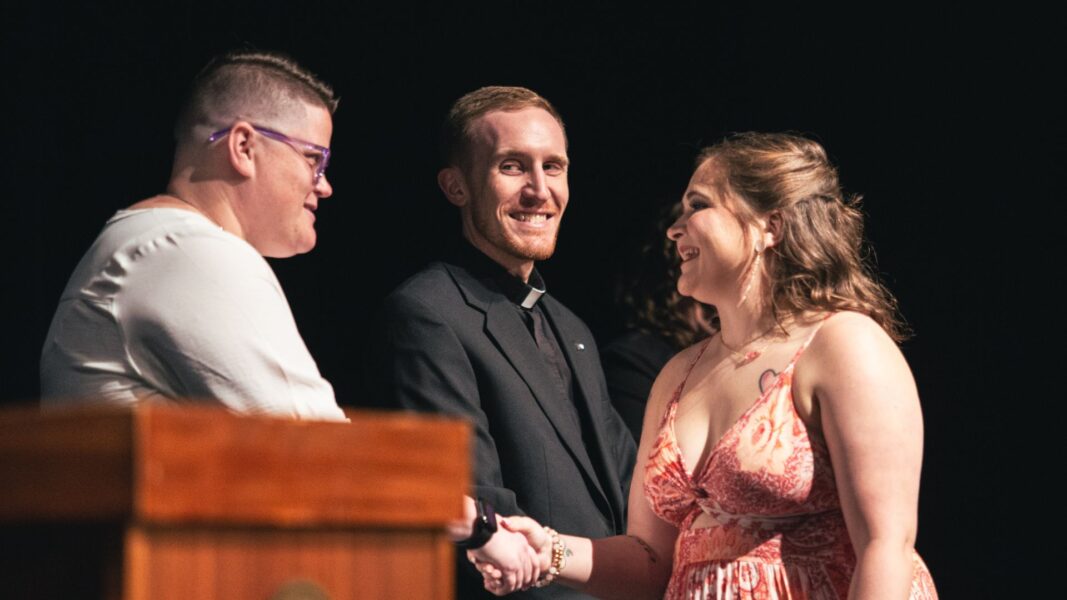 Director of Nursing Ashton Clarkson (left) congratulates a student during the May 2024 Newman nurse pinning ceremony.