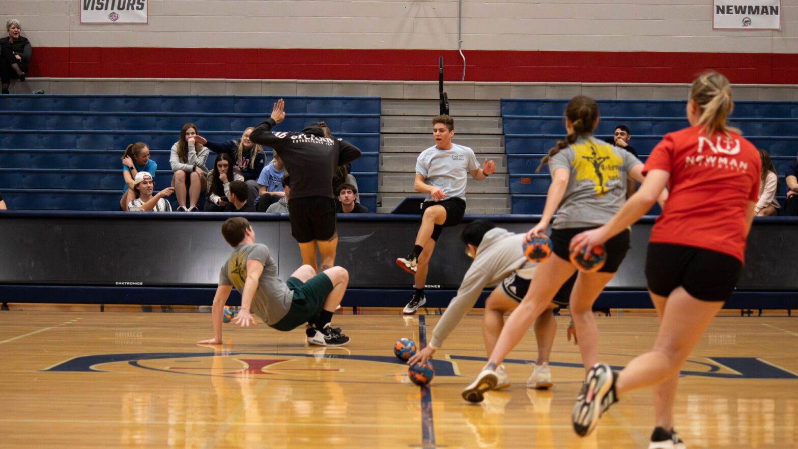 Student compete in a campus-wide dodgeball tournament with CAB and Student Life at Newman.