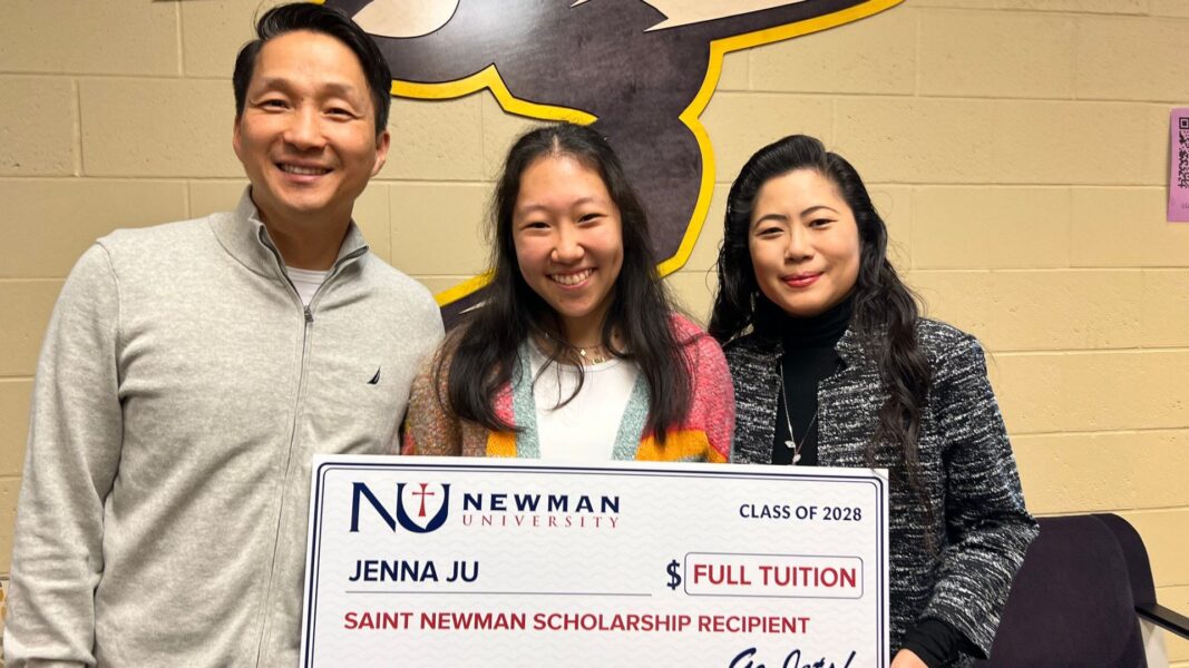 Ju and her parents stand with a big check in the amount of "full tuition to Newman University."