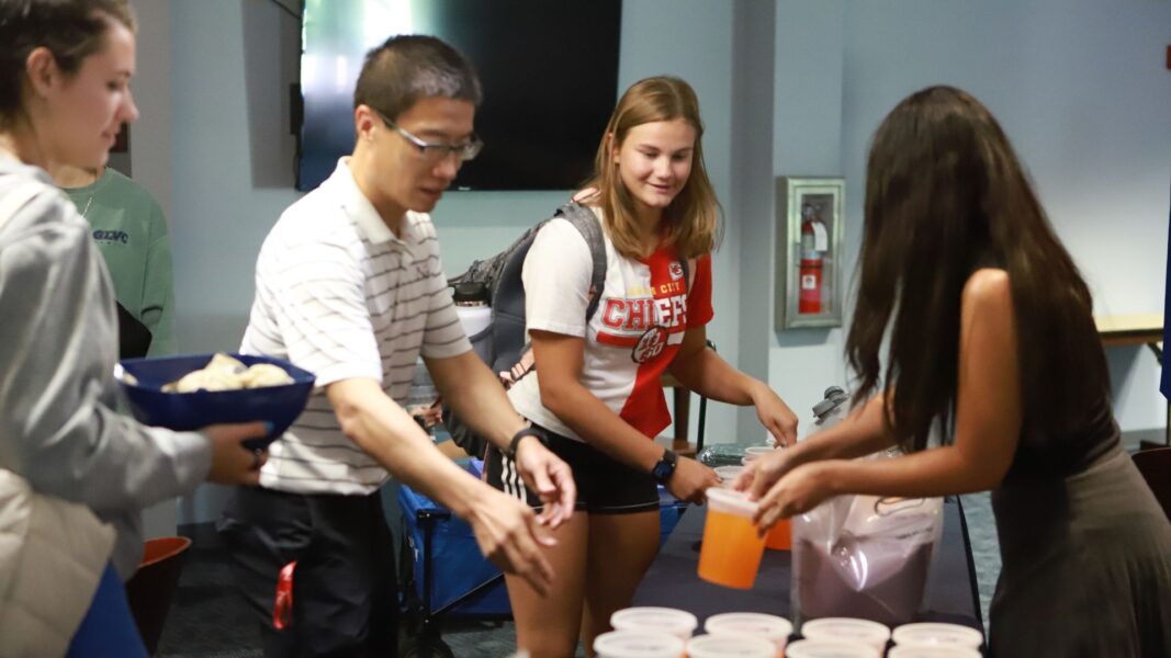 Pearson helps Student Life set up boba and bao during a welcome back week event in the Student Activities Center.