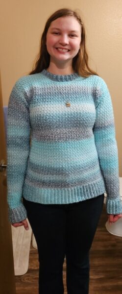 Annen, mental health project coordinator. Fun Fact: Annen crocheted this sweater!