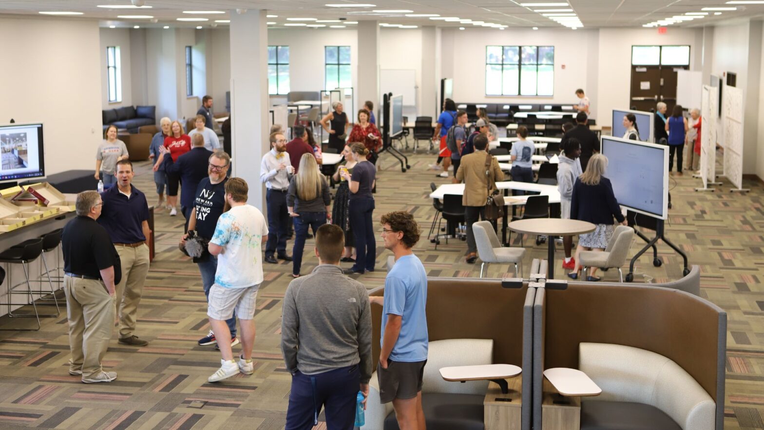 Students, staff, faculty and ASC sisters gather to celebrate the grand opening of "The Hub" at Newman University.