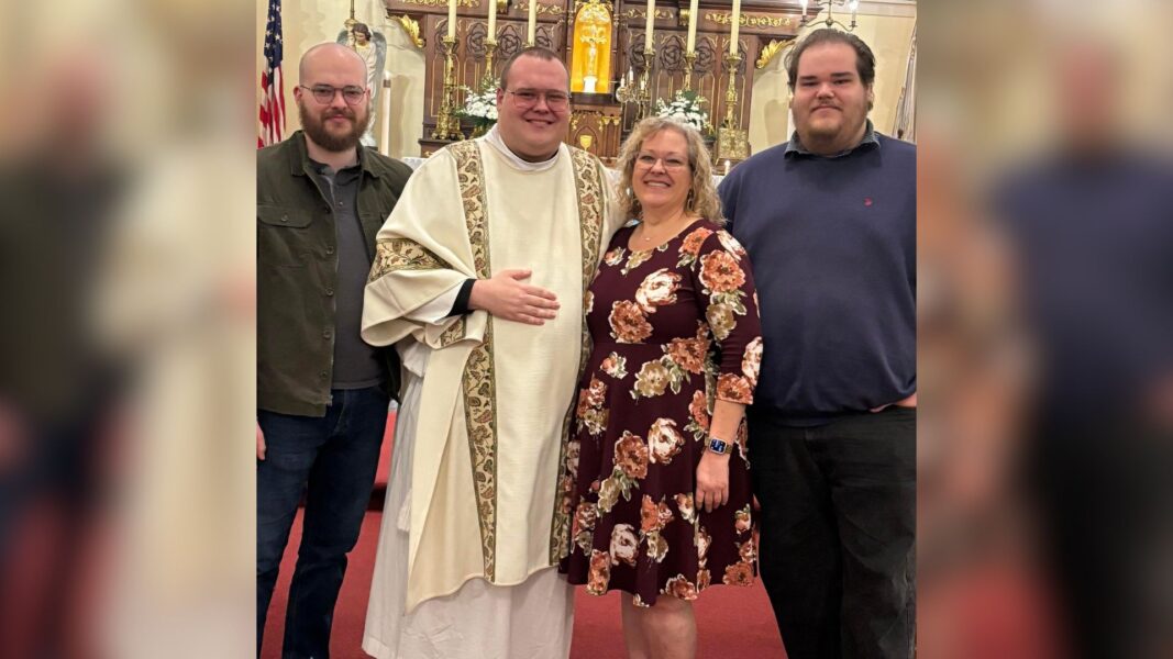 Deacon Sean Dodd (center, left) and family members after his ordination in March 2024.