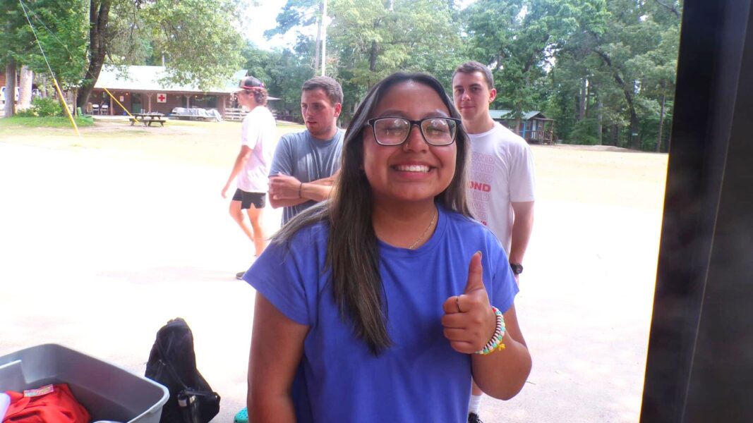 Arguijo gives a thumbs-up at a camp called “The Pines” in Big Sandy, Texas.