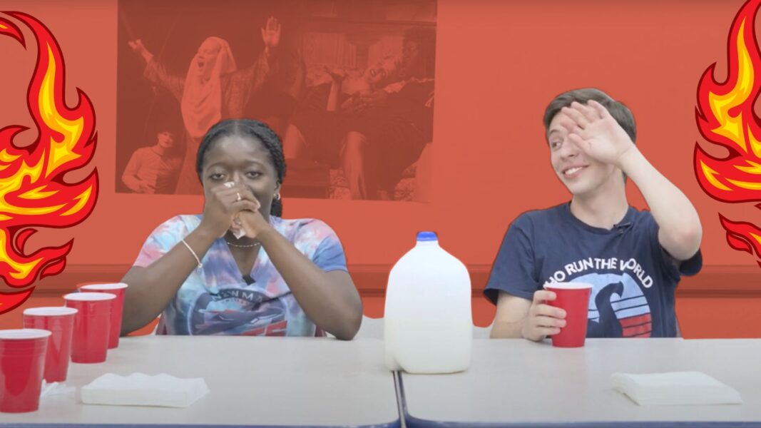 Students Travia Smith and Deqlan Mitchell during the "Hot Ones" challenge at Newman University.