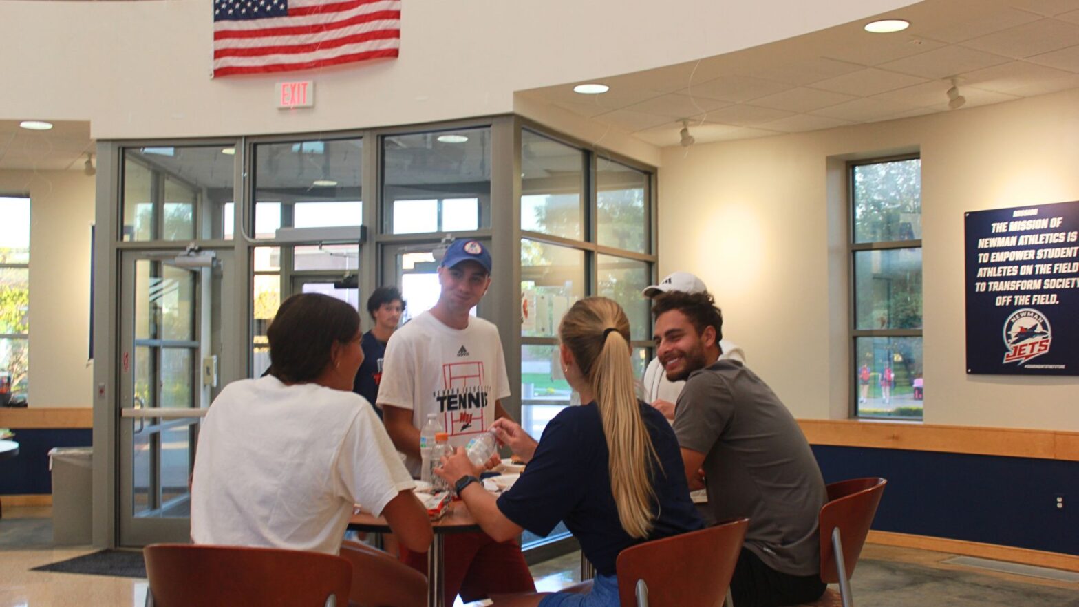 Students chow down on grilled hamburgers and hot dogs during the international student mixer.