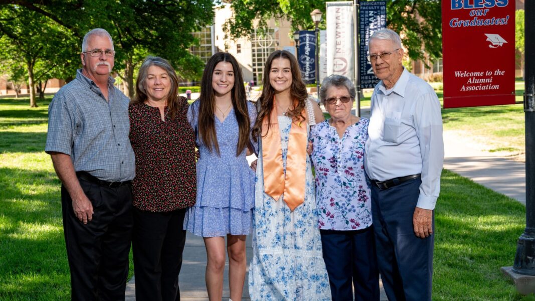 Kates (center) with her family on the Newman University campus.