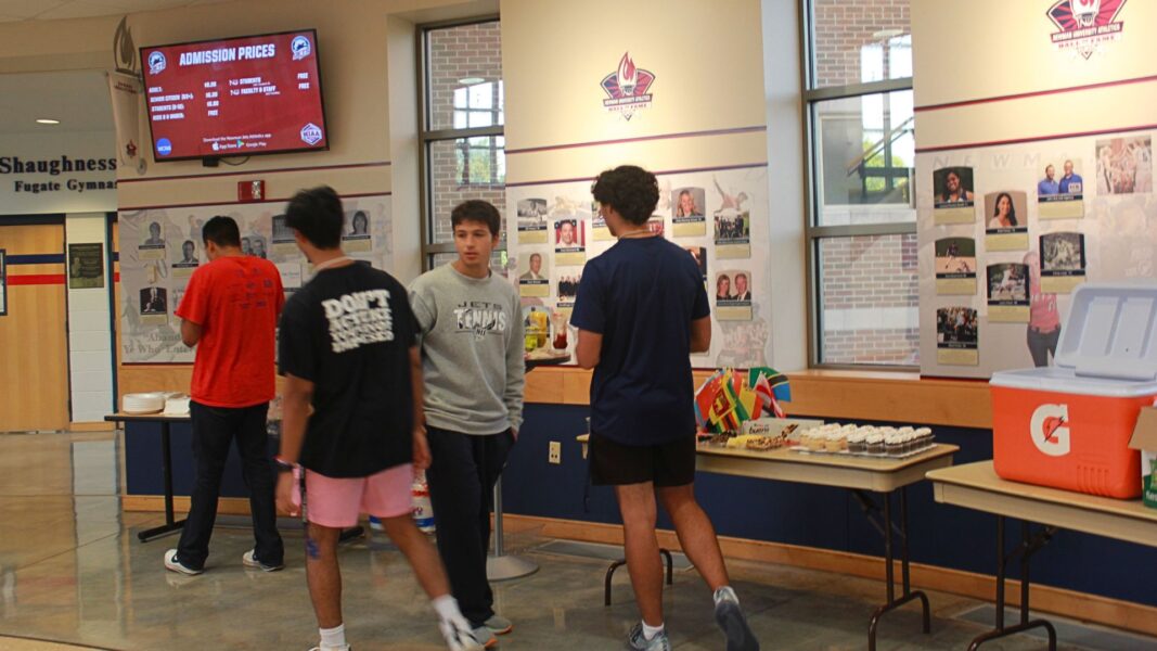 Students stop by the snack table of chips and cupcakes.