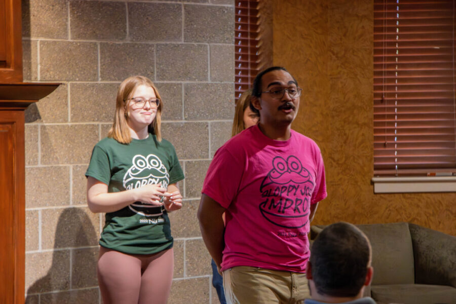 McGrath and Cubias perform with fellow Sloppy Joe Improv team members for a fall graduate mixer at Newman University.