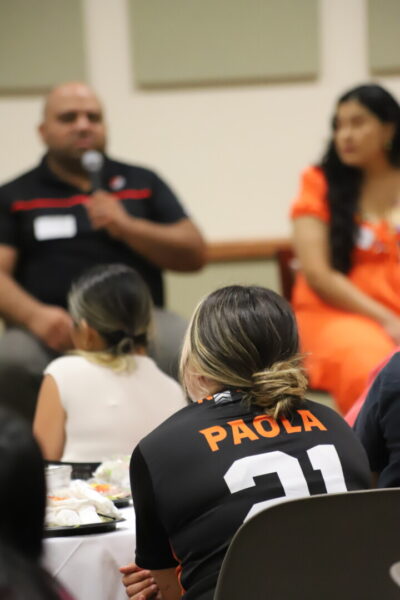 Attendees listen as panelists share during La Cadena.