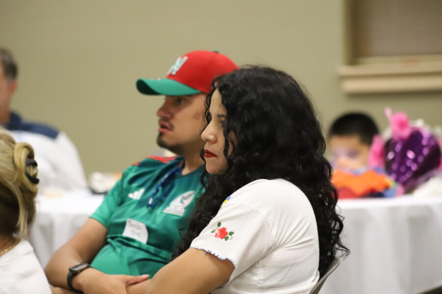 Attendees listen as panelists share during La Cadena.