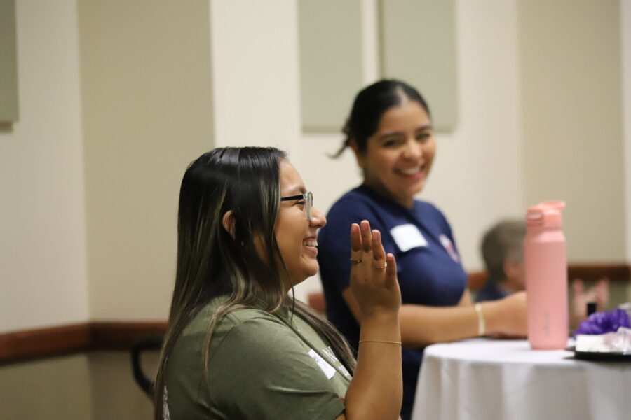 Newman student and HALO president Melissa Arguijo (foreground) and Rodriguez (background).