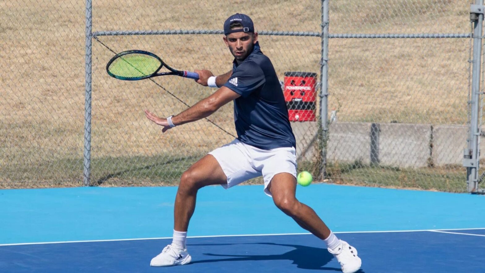 Mounir prepares to hit the tennis ball.