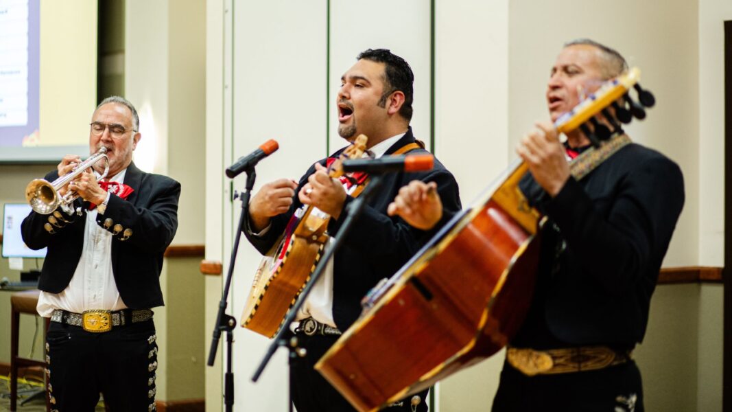 A mariachi band performs during Día de los Muertos at Newman University.