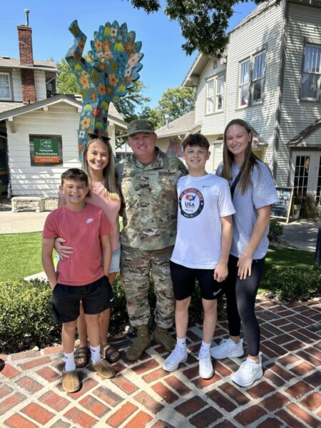 Smith (center) and his family