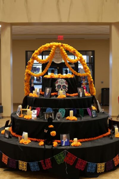 An ofrenda invited guests to honor loved ones' memories by sharing photos.