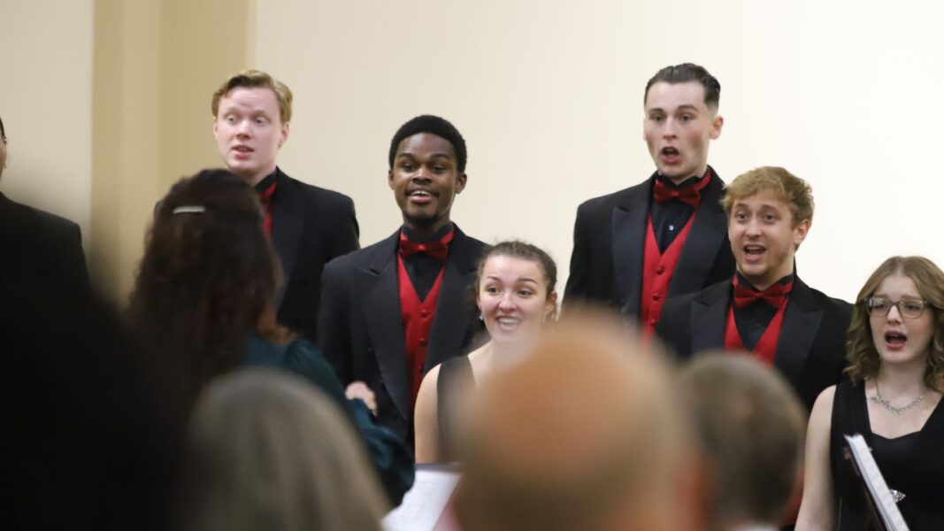 Lotsu-Morgan smiles as he sings in St. John's Chapel.