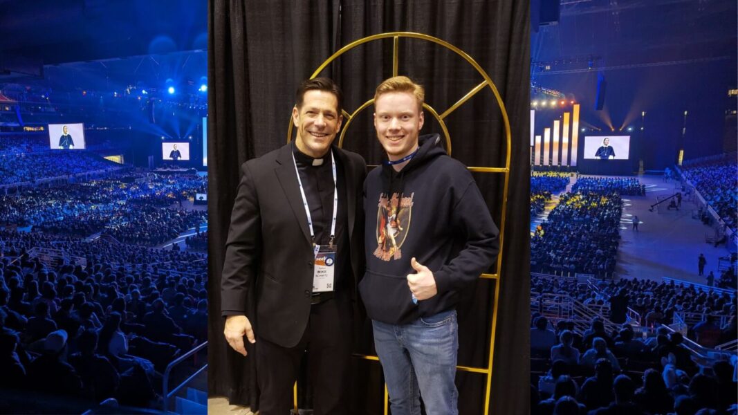 (From left to right) Father Mike Schmitz and Newman University student Steven Brown.