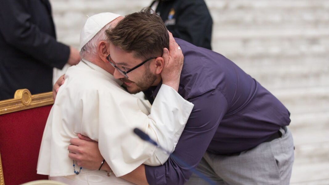 Pope Francis embraces Olivas at the Synod.