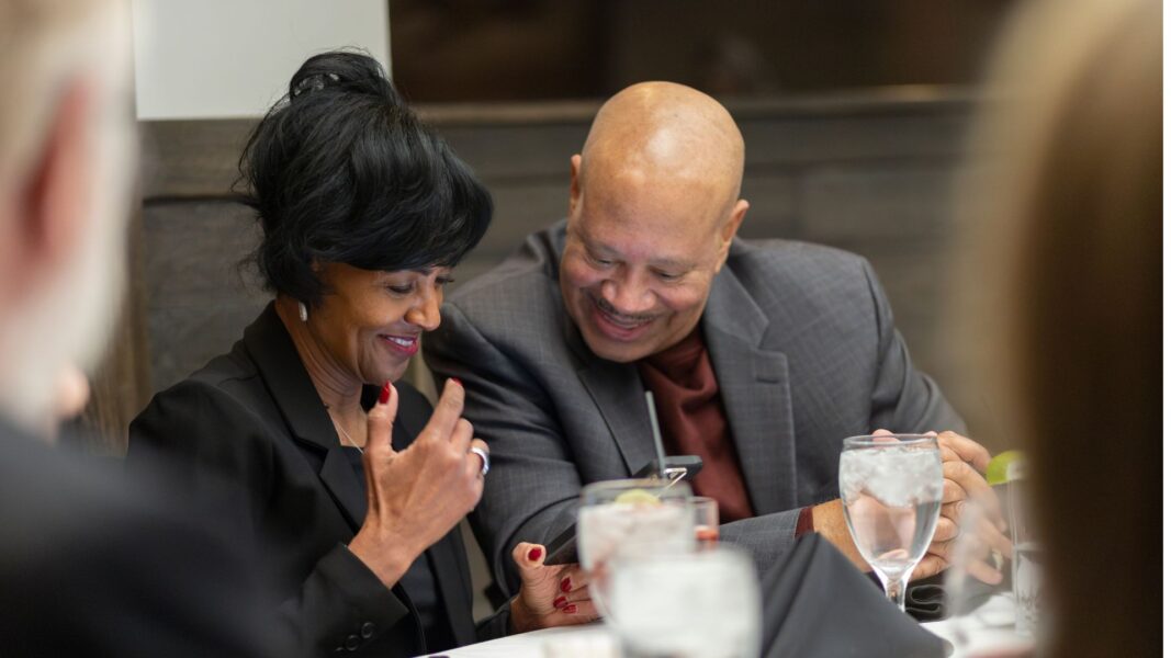 Terri Rice smiles with partner at DBA dinner