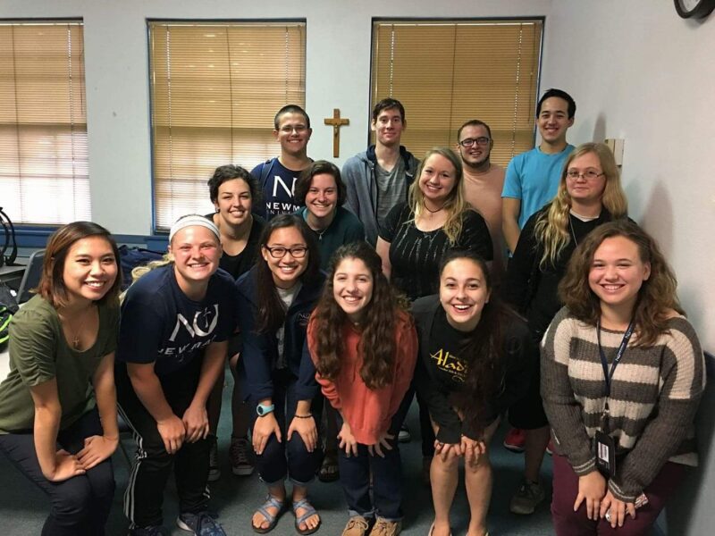 Becker (far right, middle row) with fellow graduates of the Newman University Honors Program.