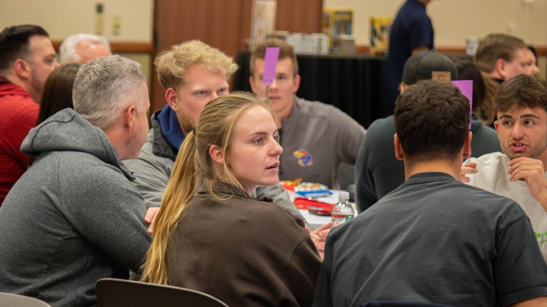 A mix of students, staff, and alumni compete during trivia night at Newman University.