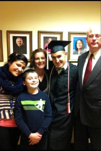 (From left to right) Rashell, Daniel, Rosy, Lozada and Graber celebrate Lozada's graduation from Newman University.