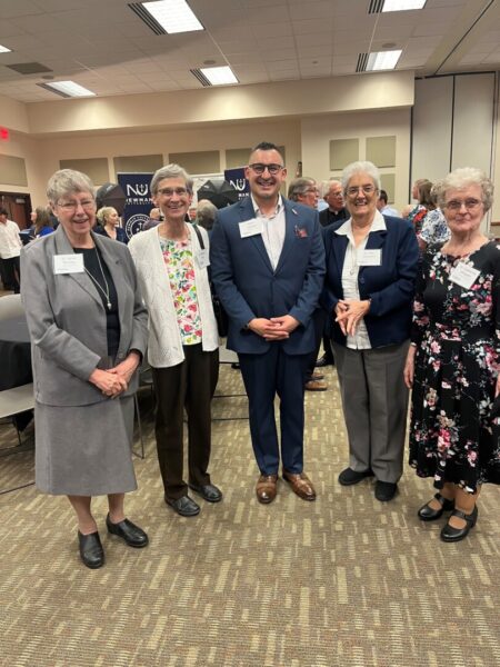 Lozada (center) with sisters of the Adorers of the Blood of Christ (ASC) at Newman University.