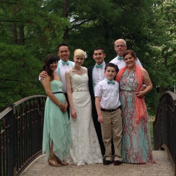 Lozada, his wife, and family gather for a photo on Lozada's wedding day