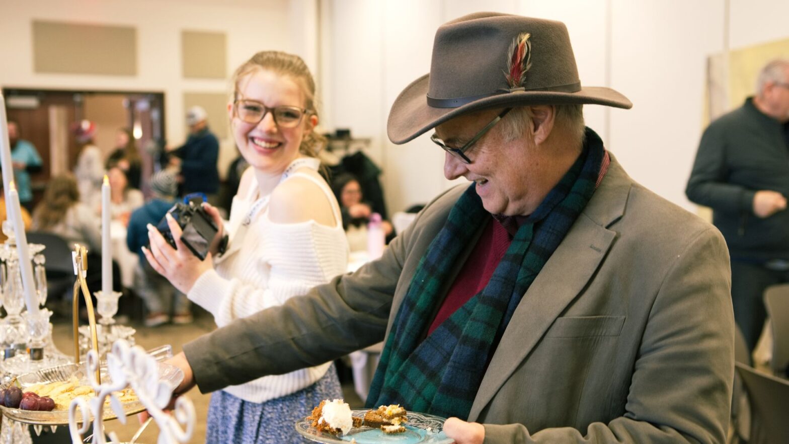 Student Dannicka McGrath and associate professor and director of theater Mark Mannette shared their best British accents during Newman's High Tea.