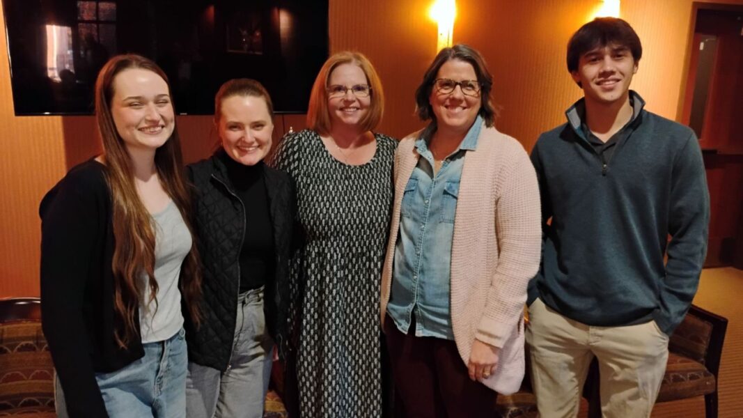 Dylan (far left) and Nika (second from the left) participate in a Veterans Day panel at Newman University to share their experiences in a military family.