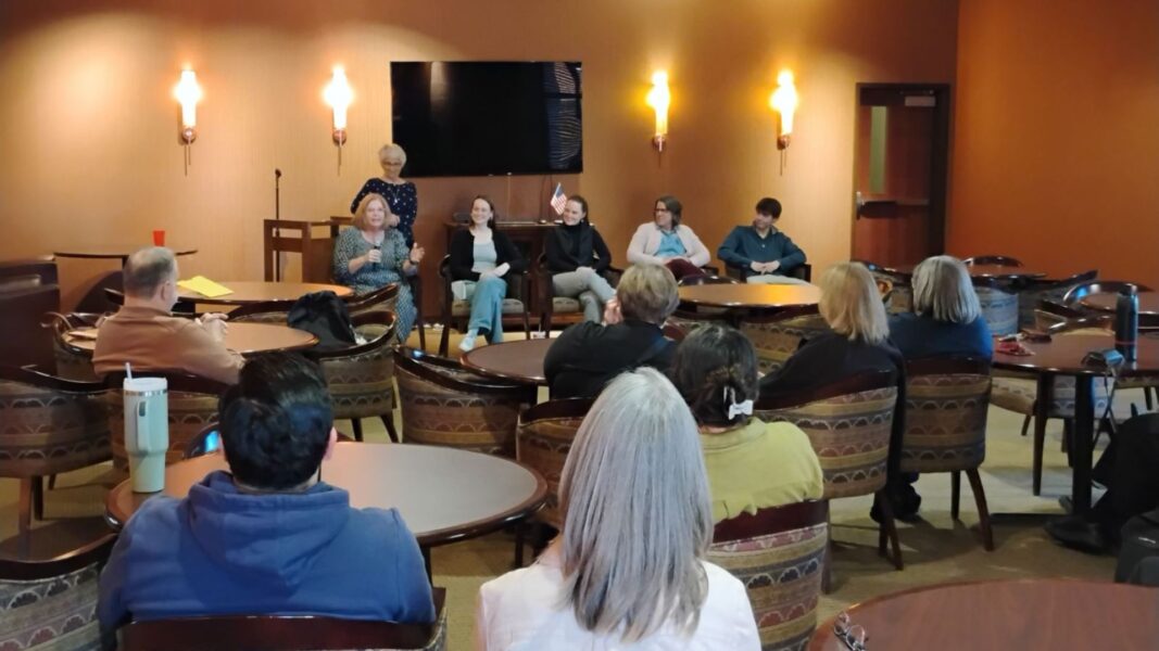 Guests listen to the Veterans Day panel in November 2024 on Newman University's campus.